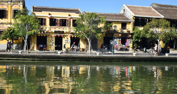 Colorful buildings and promenade along a waterway.