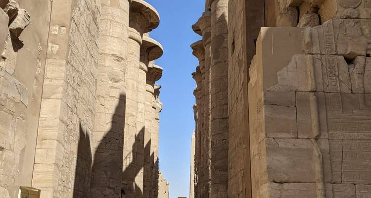 Massive stone columns with hieroglyphs in the ancient temple.