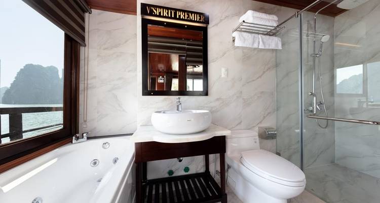 Bathroom with jacuzzi in a luxury cabin overlooking Halong Bay.