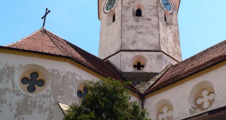 Tower of a historic church with cross