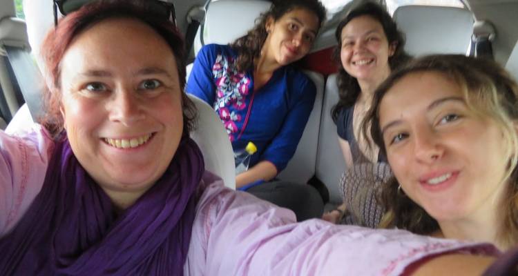 Group of friends taking a selfie in a car.