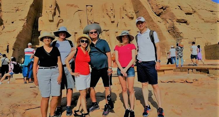 A group of tourists posing in front of the Abu Simbel temples.