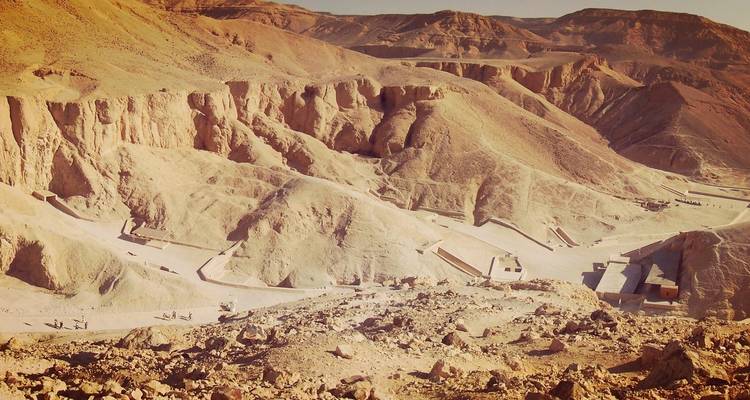 Aerial view of dry desert hills and valleys.