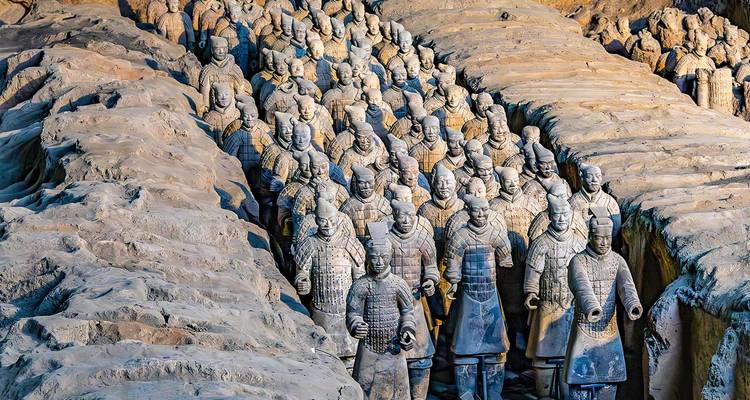 Rows of life-size Terracotta Warriors stand in excavated pits at Xi’an’s famed archaeological site.