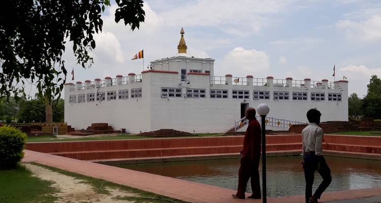 Buddhist site with monks walking in Lumbini.