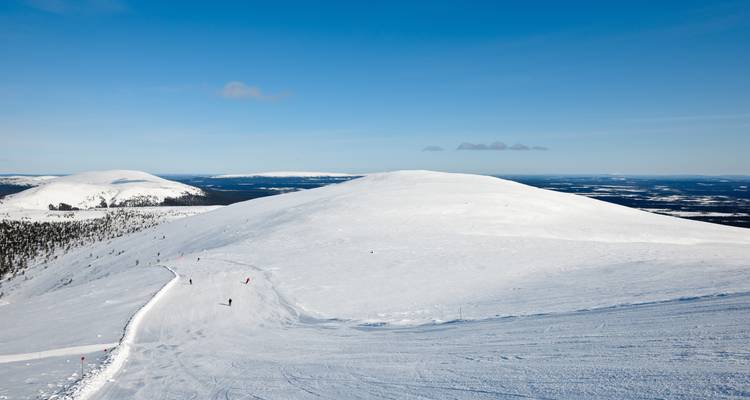 Snow-covered mountain ridge on a clear day.