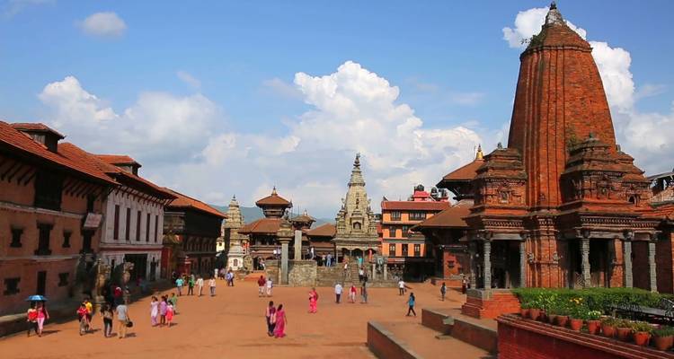 Historic square with traditional architecture and people