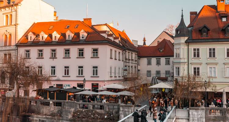Busy street scene with traditional European architecture.
