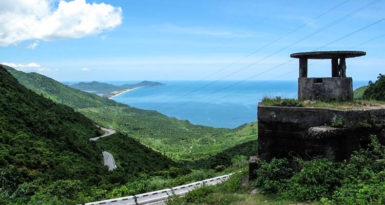 Coastal view from a mountain road overlooking the ocean.