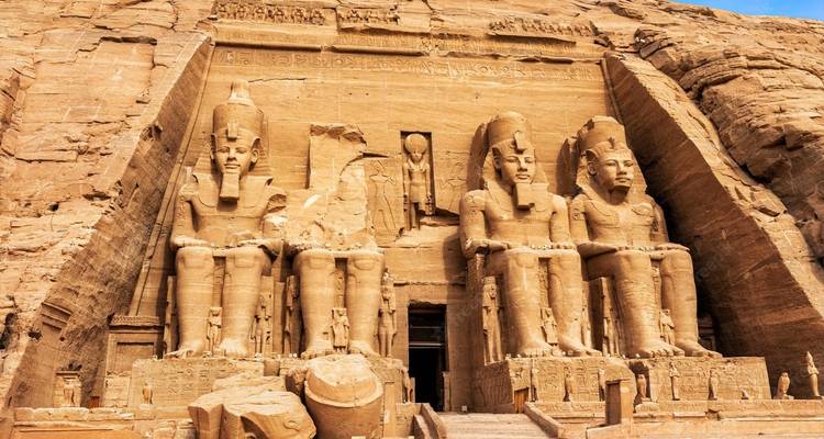 Massive statues at the entrance of Abu Simbel, an archaeological site.