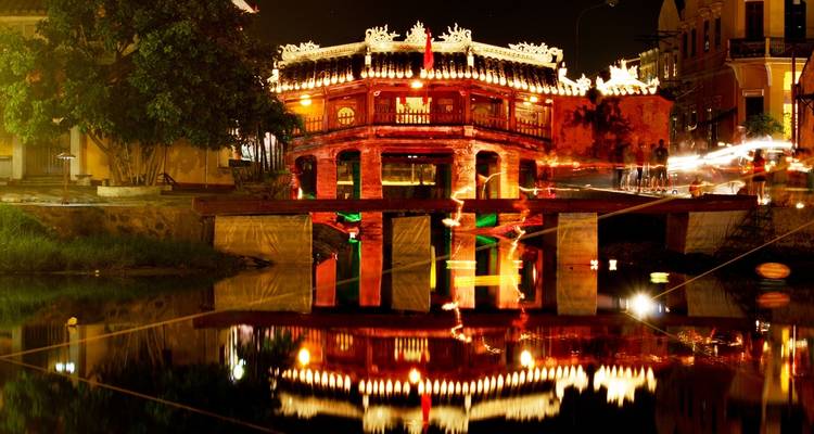 Japanese Covered Bridge in Hoi An illuminated at night.