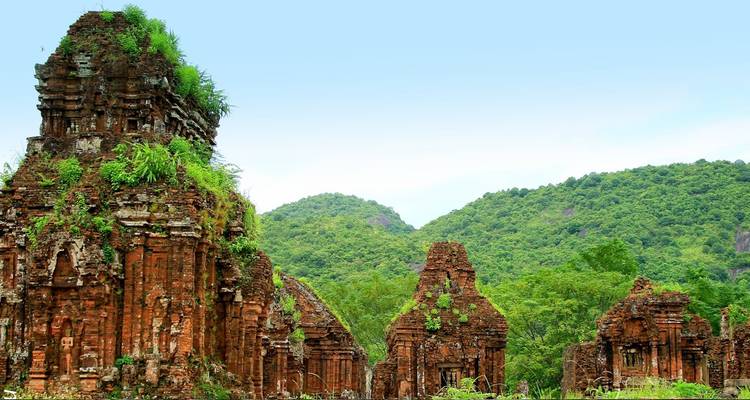 Ruins in a lush green jungle setting.