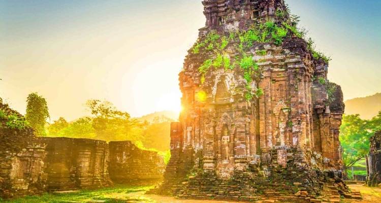 Temple ruins with sun setting behind.