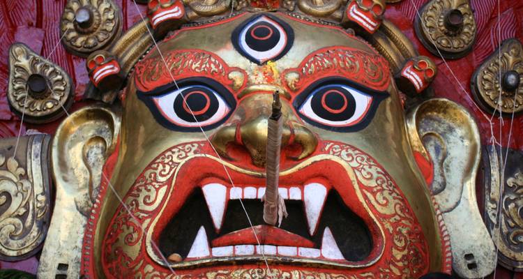 Close-up of a traditional, ornate mask with vibrant colors.