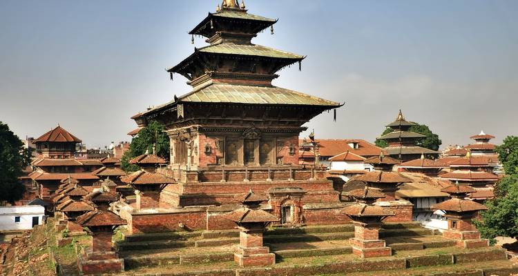 Ancient temple complex with tiered roofs and intricate woodwork.