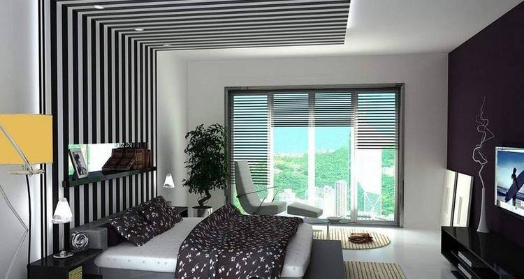 Habitación de hotel moderna con vista a la exuberante vegetación exterior.