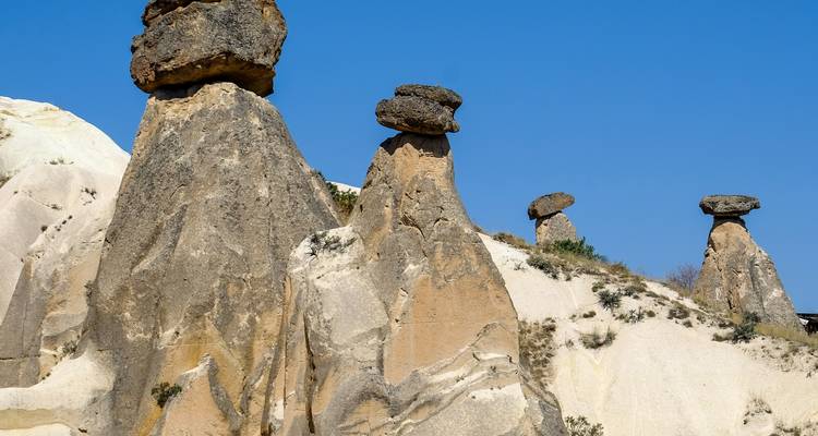 Rock formations with round stones balanced on top.