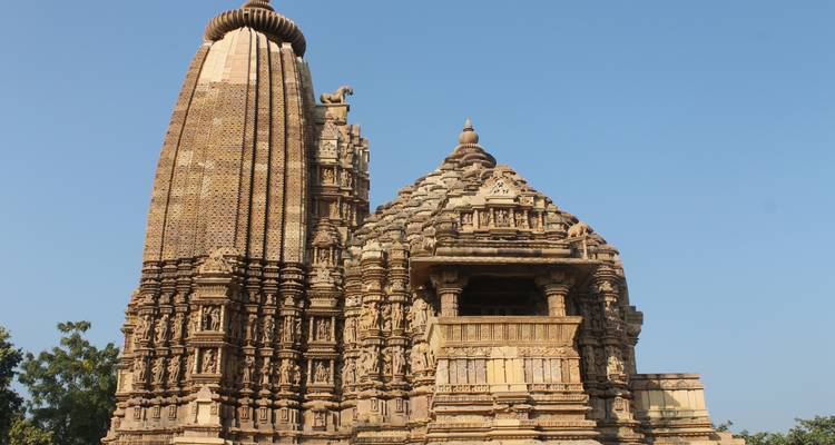 Historical temple with intricate carvings and a clear sky.