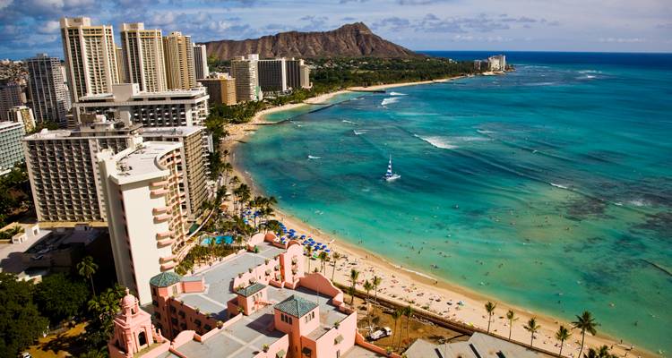 Aerial panorama of Waikiki Beach, turquoise sea and Diamond Head crater in Honolulu.