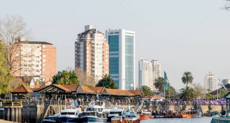 Harbor area in a city with boats and buildings.