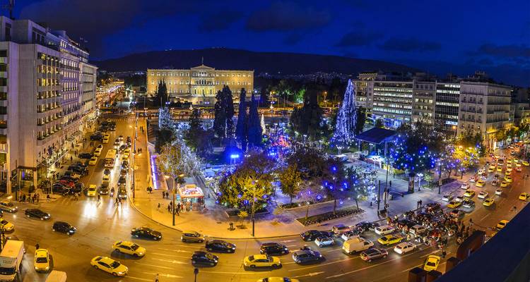 Athens cityscape with Christmas lights and busy traffic.