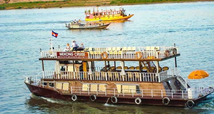 Cruise boats on the Mekong River with passengers onboard.