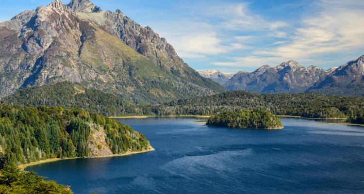 Beautiful lake surrounded by lush forests and mountains.