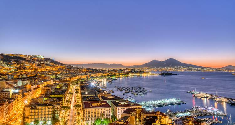 Aerial view of Naples coast with Mount Vesuvius in the background.