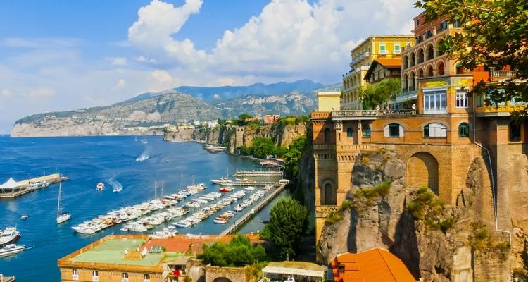 Coastal view of Sorrento with cliffs and a marina.