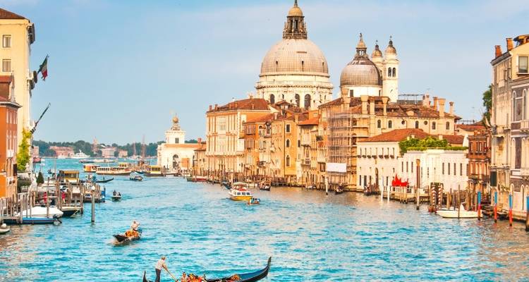 View of the Grand Canal with gondolas and historic buildings in Venice.