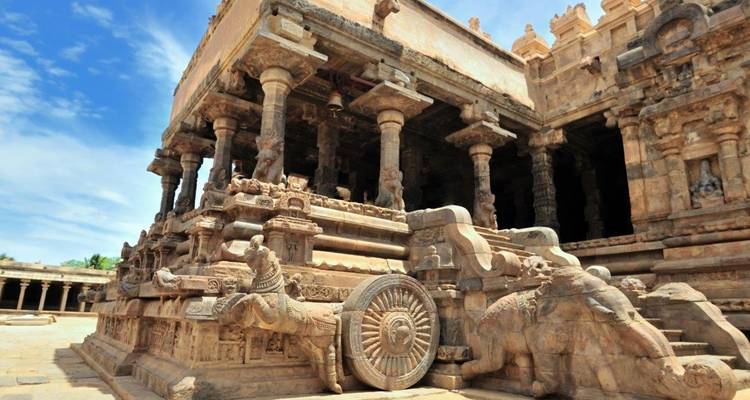Exquisitely carved stone temple with a chariot-like structure.