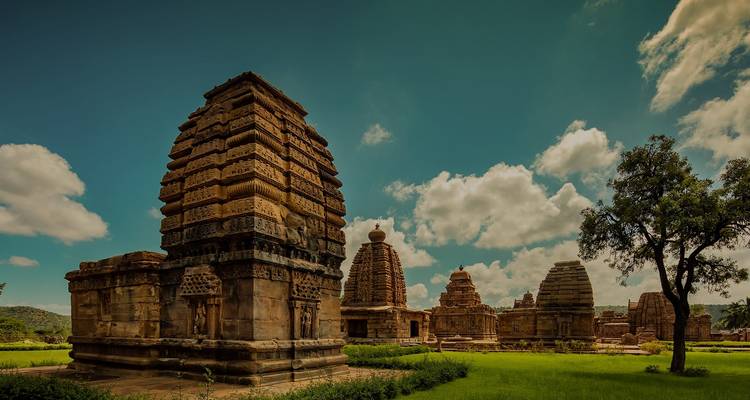 Temple complex with carved structures and clear skies.
