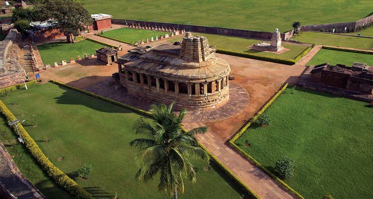 Aerial view of ancient temples and lush garden landscapes.