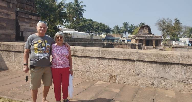 A couple posing with ancient temple ruins.