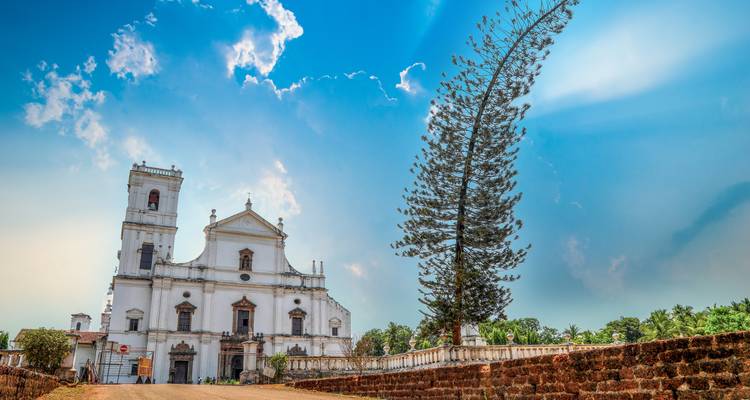 Beautiful historical church with blue sky and trees.