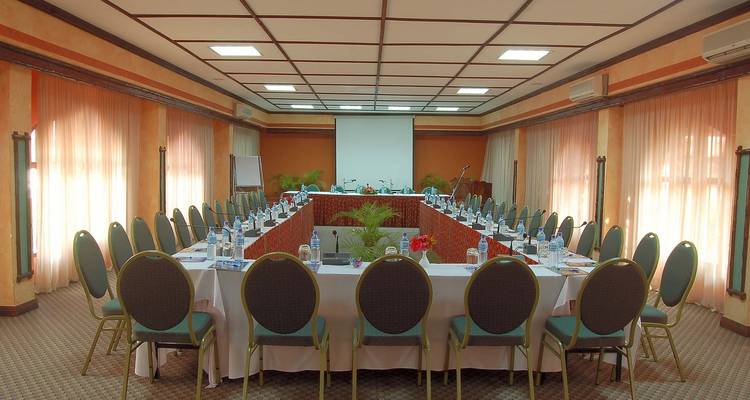 Conference room setup with chairs and tables.