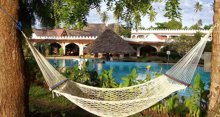 Hammock by the poolside in a tropical resort.