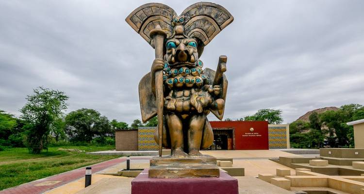 Statue of Moche warrior outside a museum.