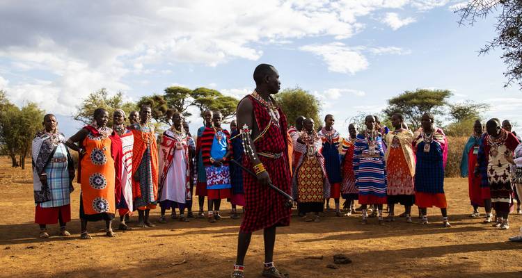 People in traditional Maasai clothing gathered in a group.