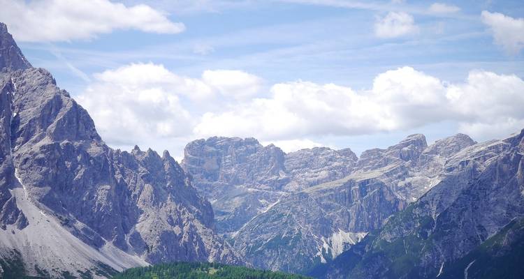 Mountain landscape with cloudy blue sky.