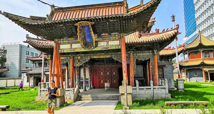 Traditional temple architecture with tourists in Mongolia.
