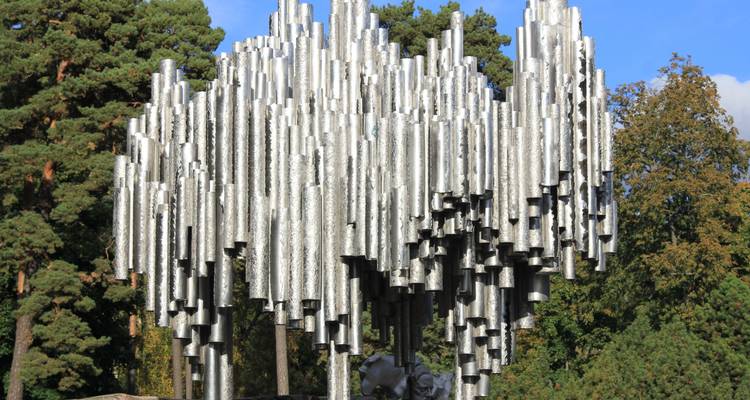 Sibelius Monument in Helsinki surrounded by trees.