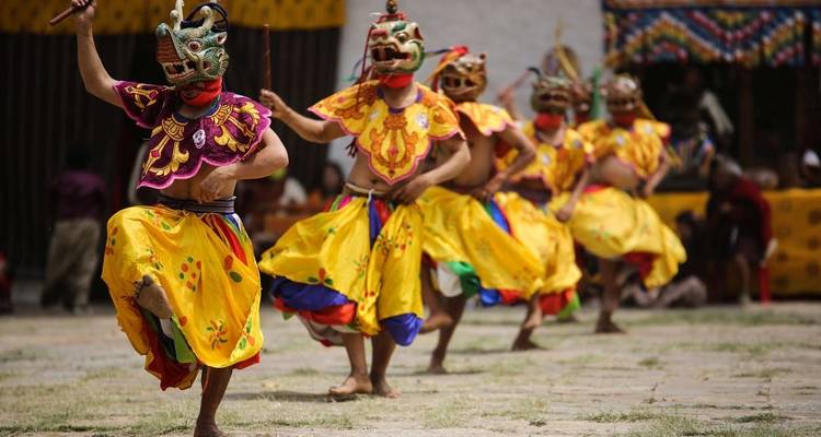 Dancers in colorful costumes performing a traditional dance.