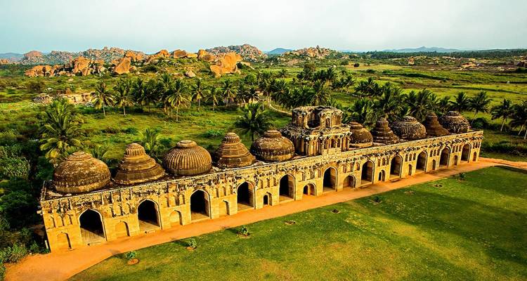 Ancient temple structure surrounded by lush greenery.