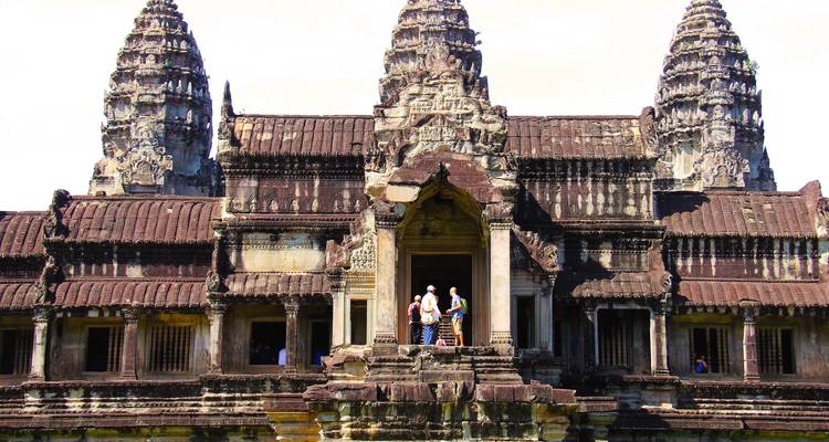 Central entrance of Angkor Wat with tourists.