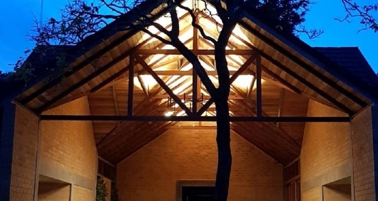 An illuminated structure during the evening.