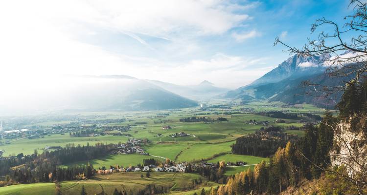 Valley view with scattered houses and distant mountains