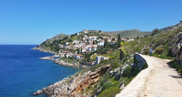 A seaside village with colorful houses on a rocky coast.