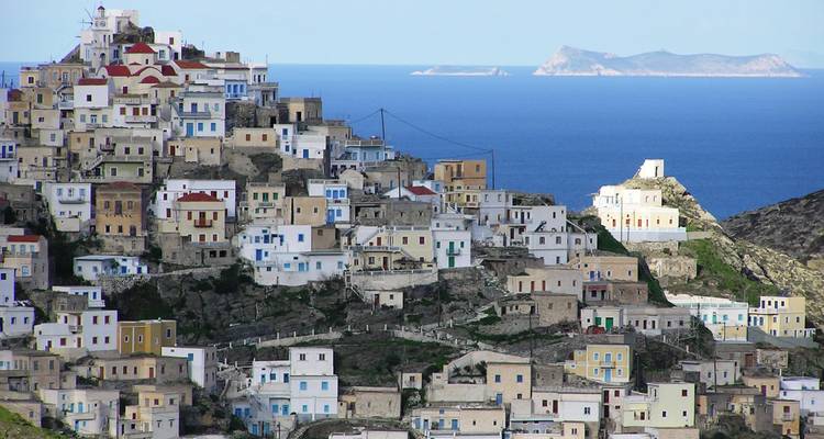 Hillside town with colorful buildings and sea view.