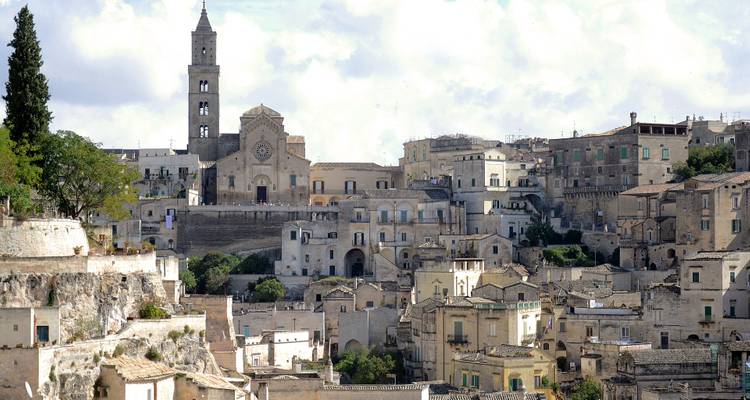 Ancient city view with tower and historical buildings.